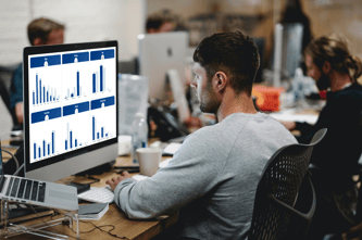 Man analyzing demographics in the Tunnl Platform on a desktop computer