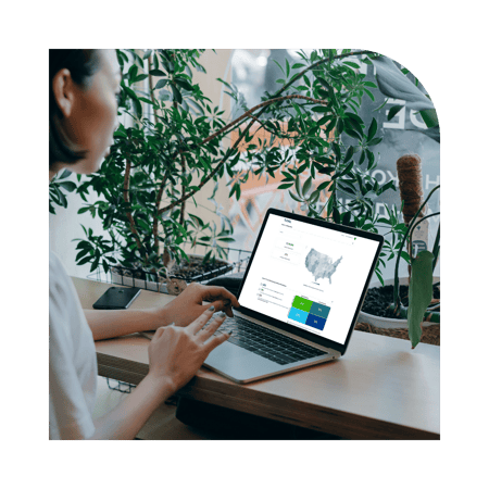 Woman using Tunnl at desk by window